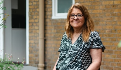 Woman in wheelchair smiling (Centre for Ageing Better for Unsplash)