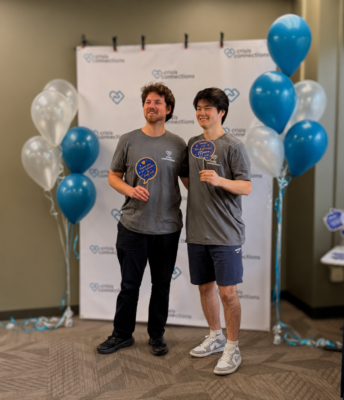 Volunteers posing for step and repeat photo