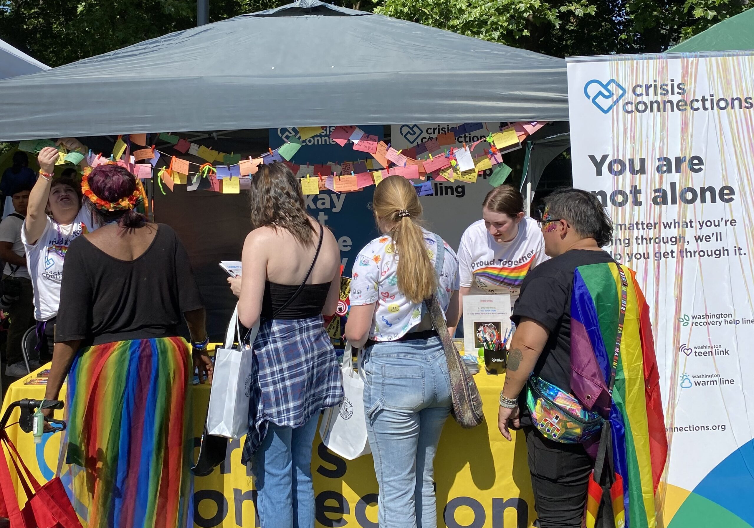 Crisis Connections booth a Seattle Pride with community members