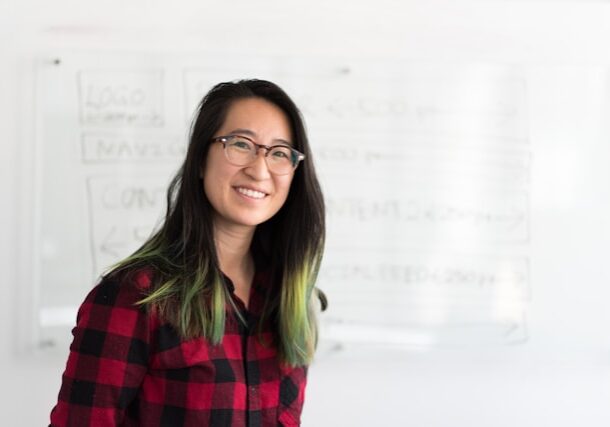 Teacher in front of white board (Christina Wocintechchat for Unsplash)