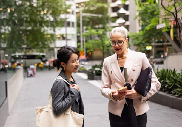 Two women looking at phone